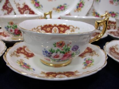 REGENCY, ENGLAND (GENUINE BONE CHINA) FLORAL SPRAYS, MAROON & TAN CARTOUCHE (c.1952) CUP & SAUCER- SCALLOPED- EXCELLENT !! RARE !!
